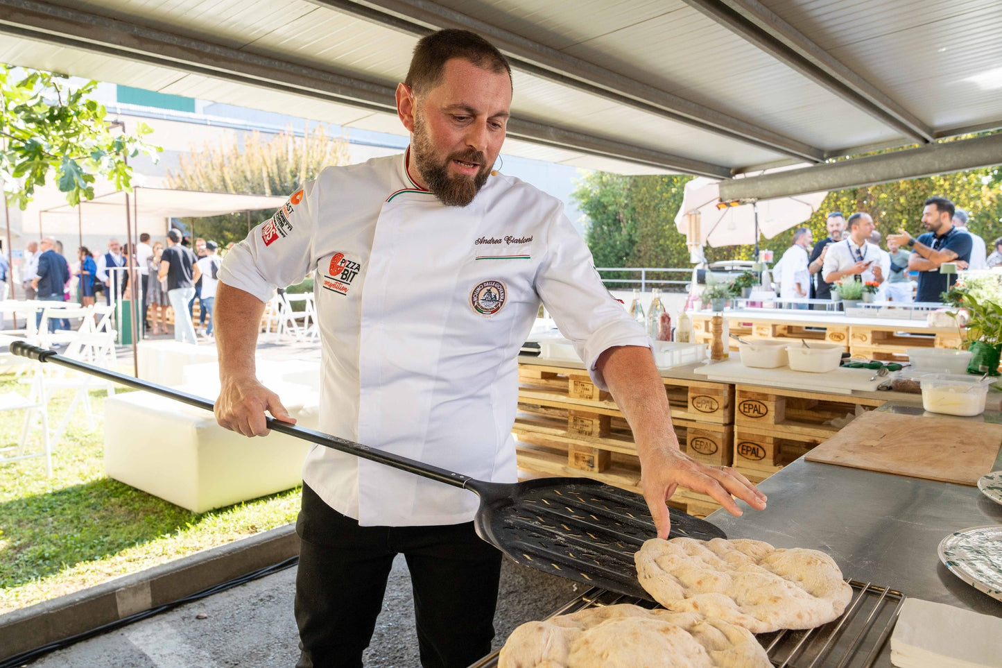 Professional pizzaiolo at Italian food festival