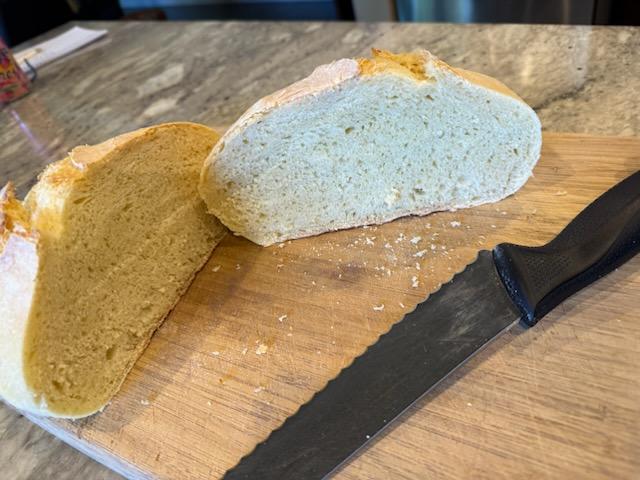 Sliced artisan bread showing soft crumb